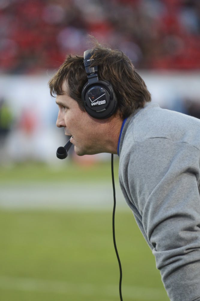 Will Muschamp looks down the field following Florida's 38-20 win against Georgia on Saturday
