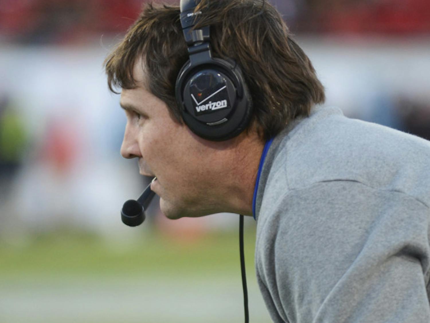 Will Muschamp looks down the field following Florida's 38-20 win against Georgia on Saturday