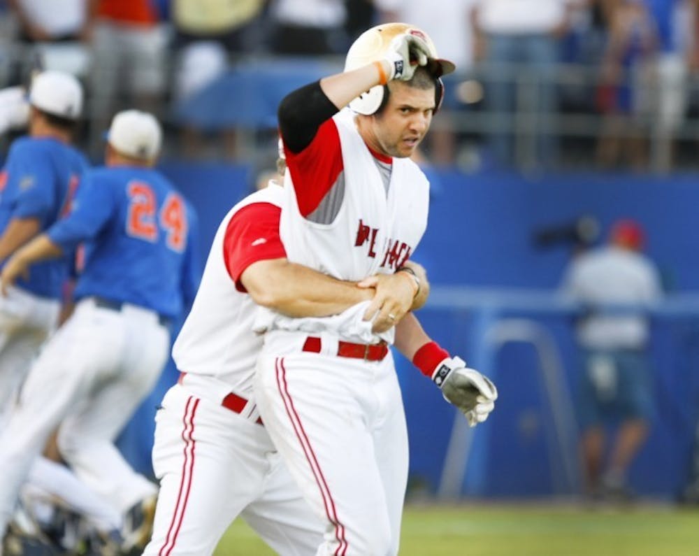 <p>N.C. State shortstop Chris Diaz reacts after striking out looking to end the game against Florida on June 10. Diaz sought out home plate umpire Steve Corvi to argue the call.</p>