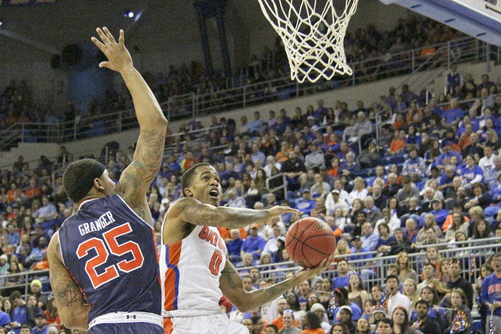 <p>Florida's Kasey Hill attempts a layup during UF's 95-63 win over Auburn on Jan. 23, 2016, in the O'Connell Center.</p>