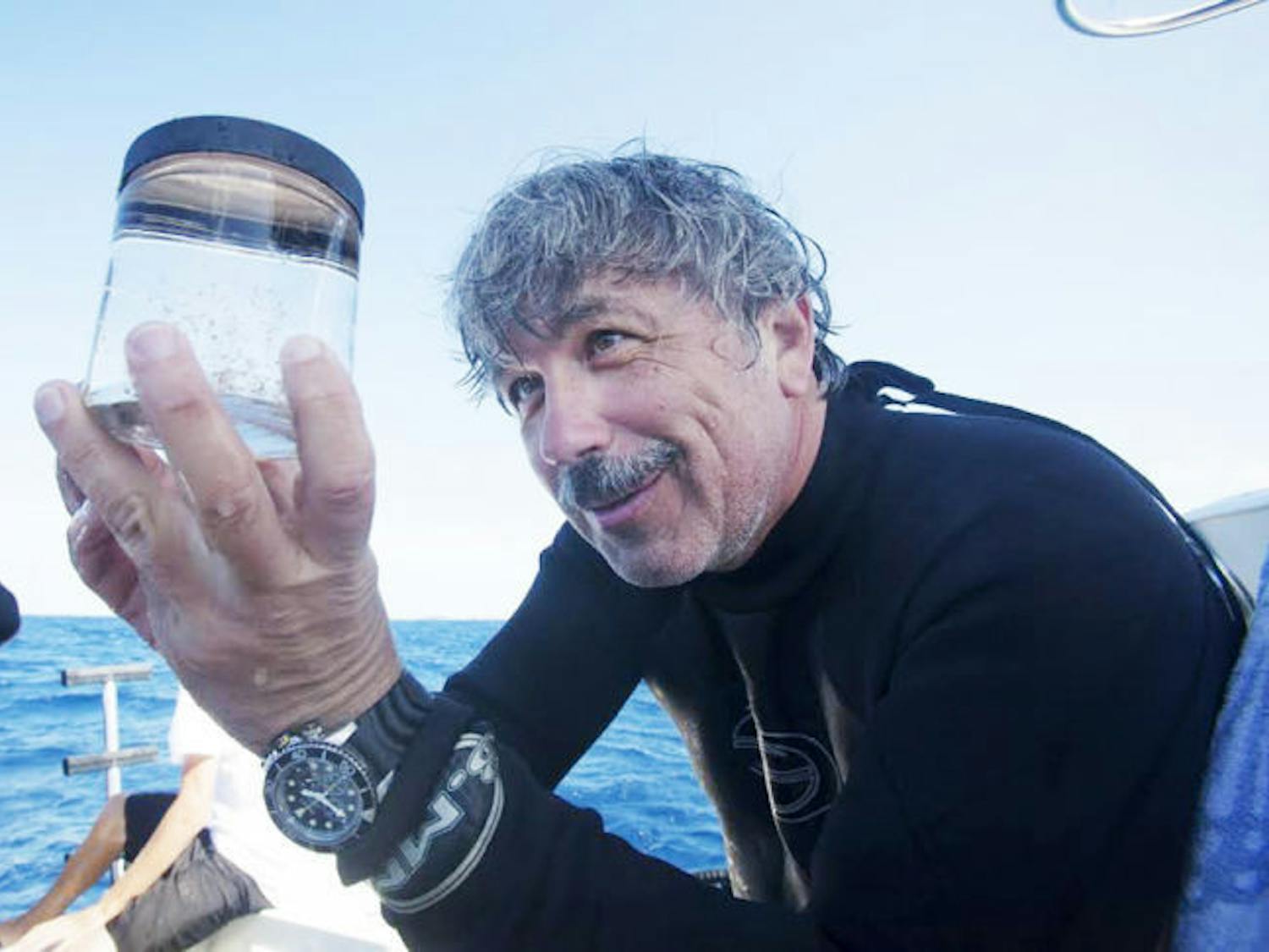Professor Leonid L. Moroz holds a jar with unique siphonophore species and some comb jellies just recovered from deep blue of Golf Stream. These animals were used for genomic analysis in the Moroz lab.