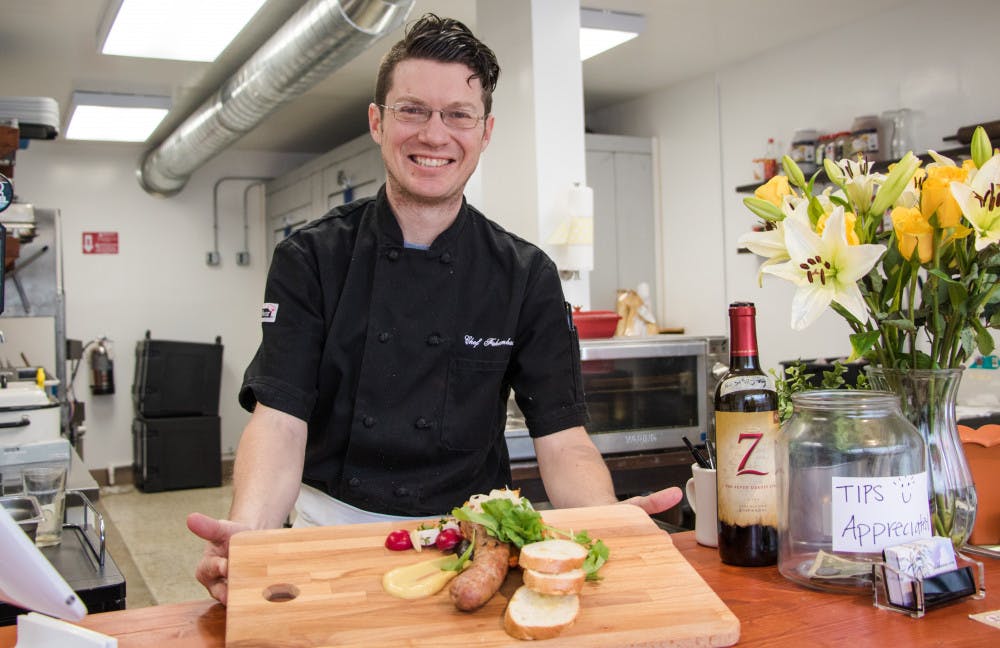 Adam Fehrenbacher, 37, owner of Fehrenbacher’s Artisan Sausages, showcases one of his favorite sausage plates to prepare, the Filipino longaniza. Fehrenbacher’s store had its grand opening Saturday.