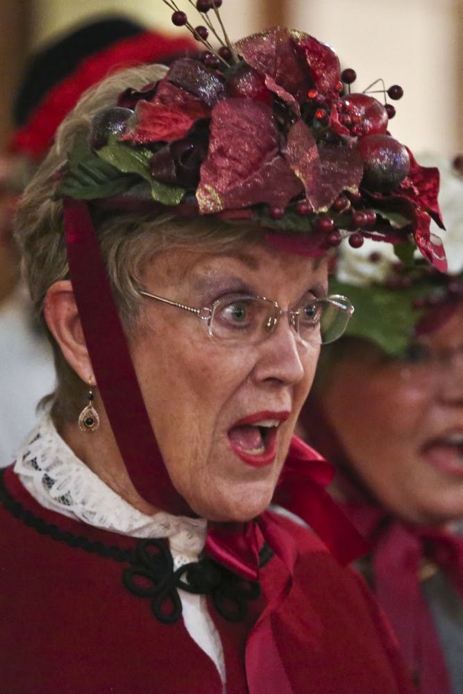 Karen Caraway carols with the Gainesville Harmony Show Chorus during the annual Holiday Tree Lighting ceremony at the Historic Thomas Center on Dec. 5, 2015. She has sung with the choir for 23 years.