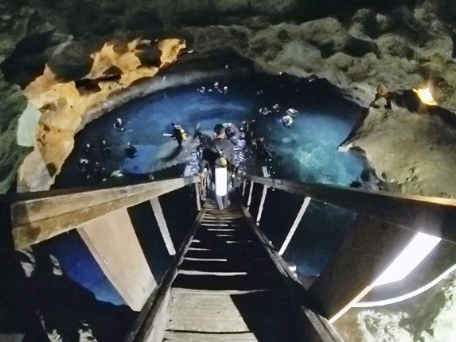 A diver descends into Devil’s Den before Scuba Monkey Dive Center’s third annual night underwater Easter egg hunt Saturday. Hidden in the springs were more than 300 different dyed eggs and three golden eggs. Prizes included a Tusa Nitrox dive computer, a Big Blue 750 lumens LED light and an Epcot DiveQuest trip.