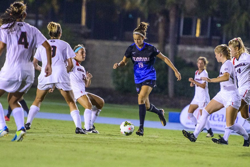 Havana Solaun dribbles the ball around six Georgia defenders during UF's 2-1 win against UGA.