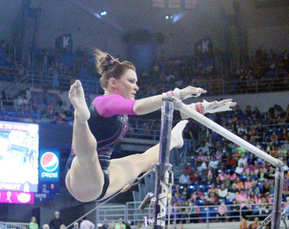 <p>Bridget Sloan performs a bar routine during Florida’s 198.125-197.625 win against LSU on Feb. 21 in the O’Connell Center.</p>