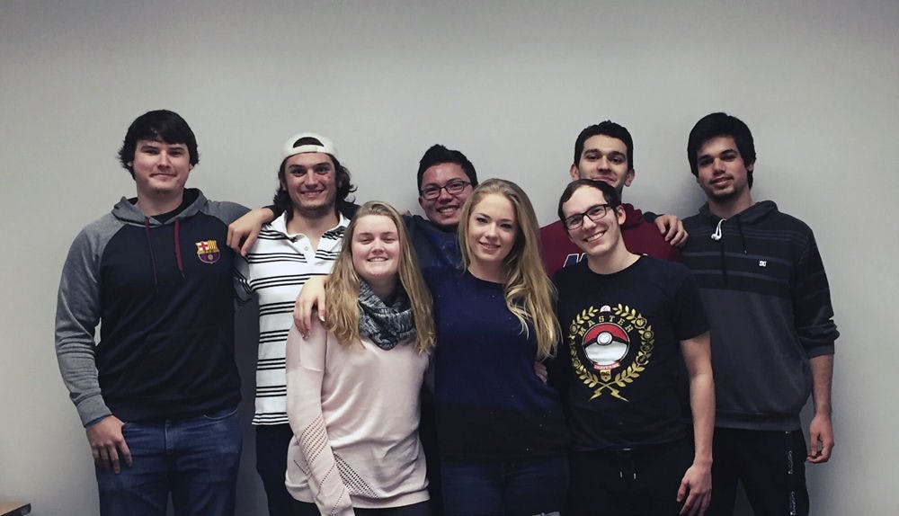 From left, clockwise, University of Florida Odyssey of the Mind team members Raymond Salzmann, John Michael Timmel, Niell Shikada, Shandy Sulen, Camilo Gonzalez, Brian Hayes Emily Long and Samantha Patten, pose for a photo. Odyssey of the Mind is a competition that tasks participants with coming up with creative solutions to a variety of problems before presenting them at local, state and world-level competitions.