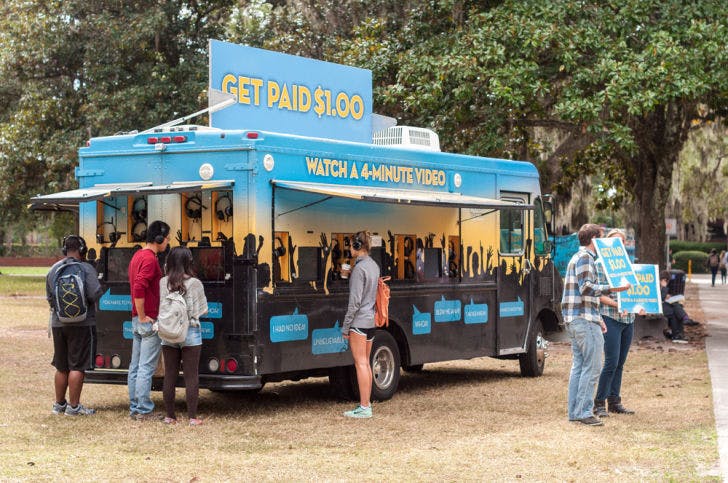 Farm Animal Rights Movement, an organization promoting a vegan diet, paid students $1 to watch a four-minute video promoting its cause Monday afternoon. The video informed viewers about the slaughter of animals for food in the U.S.