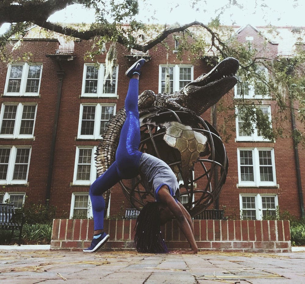 <p>Tawanya Norwood poses on UF’s campus for a self-portrait for her Instagram, @th33besticanbe. Norwood hopes to become a Nike model by getting the company’s attention with athletic photos on social media.</p>