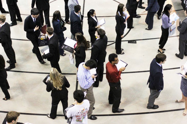 Students and alumni wait in line for the Career Showcase Non-Technical Day in the Stephen C. O’Connell Center on Tuesday. Technical Day, today, is from 9 a.m. to 3 p.m. for students majoring in engineering, biology, computer sciences and other technical fields.