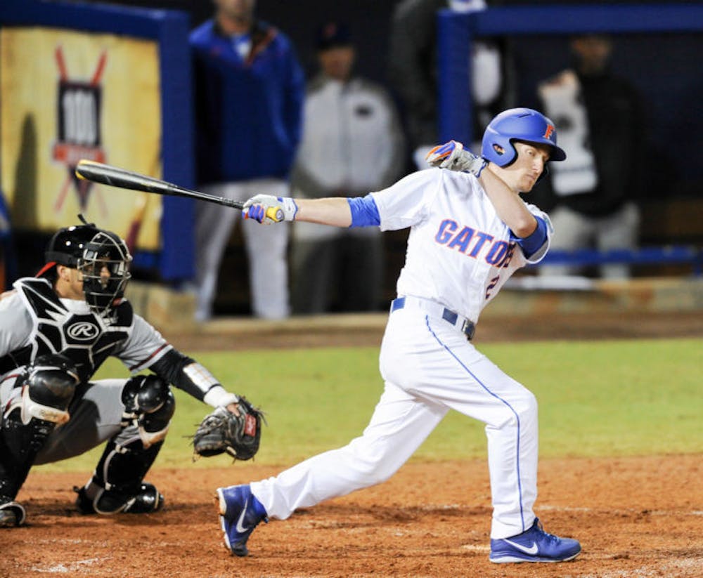 <p>Casey Turgeon swings during Florida’s 4-0 win against Maryland on Feb. 14 at McKethan Stadium.</p>