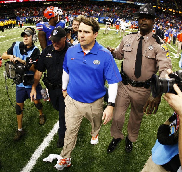 Coach Will Muschamp walks off the field following Florida’s 33-23 loss to Louisville in the Sugar Bowl&nbsp; on Jan. 2 at the Superdome in New Orleans. Muschamp owns an 18-8 record in two seasons with the Gators.