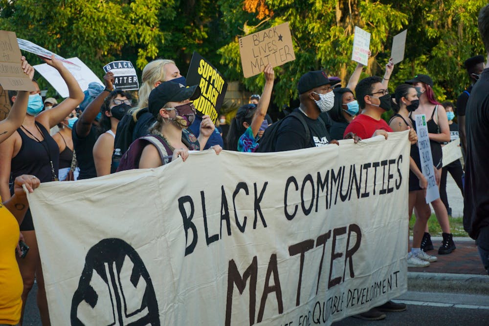 <p>Protestors march at a demonstration against building luxury student apartments on land located in in a historically Black community in Gainesville Thursday, June 18, 2020. The protest drew more than 300 people.</p>