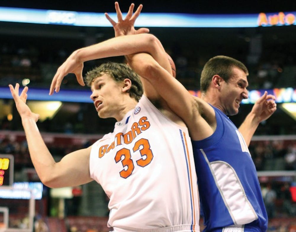 <p>Forward Erik Murphy battles for the ball against during Florida’s 78-61 win against Air Force on Dec. 29 in the BB&amp;T Center in Sunrise.</p>