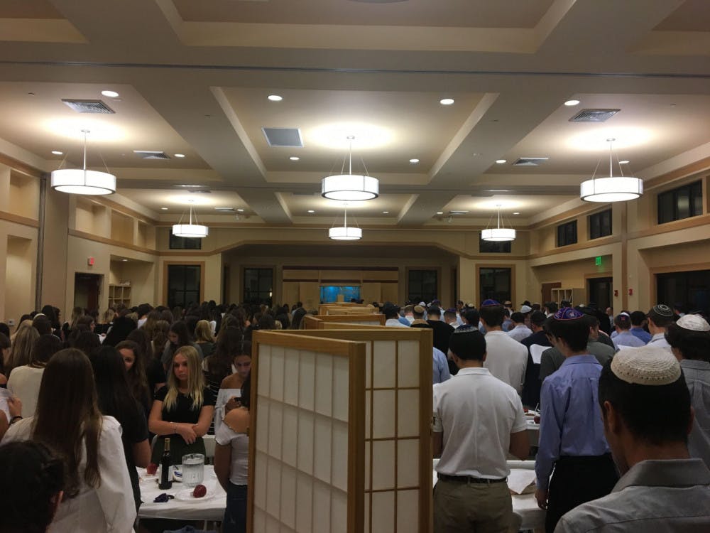 Attendees silently recite the Amidah prayer at the end of the Rosh Hashanah service at the Lubavitch Chabad Jewish Center. Photo by Christopher Harris.
&nbsp;