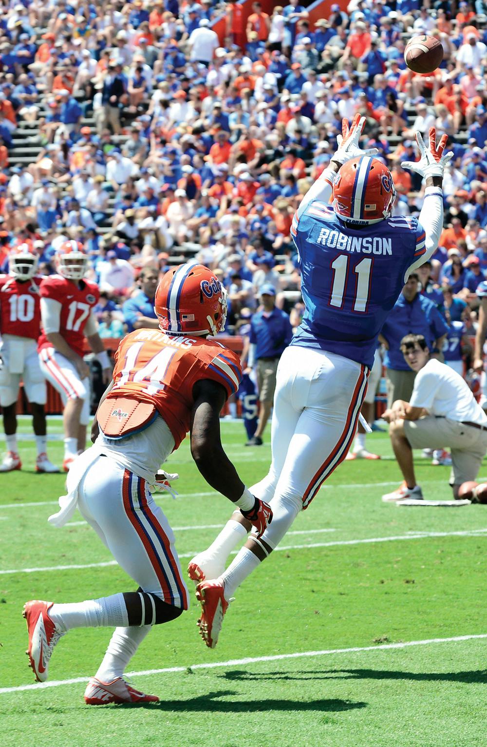 <p align="justify">Wide receiver Demarcus Robinson catches a pass at the Orange and Blue Debut in Ben Hill Griffin Stadium on April 6, 2013.</p>