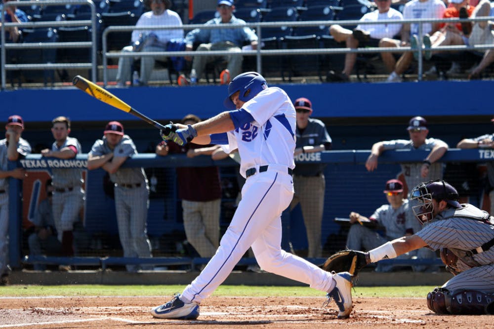 <p>JJ Schwarz follows through on a swing during Florida's 2-1 loss to Mississippi State on April 10, 2016 at McKethan Stadium.</p>
