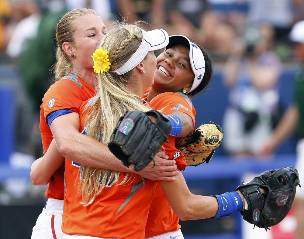<p>Florida pitcher Hannah Rogers, Taylor Schwarz, front, and Kelsey Stewart, right, celebrate after defeating Baylor 6-3 on Sunday.</p>