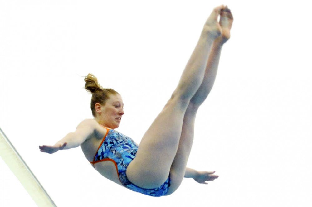 Khalia Warner dives during Florida’s meet against Auburn on Jan. 23, 2016, in the O’Connell Center.