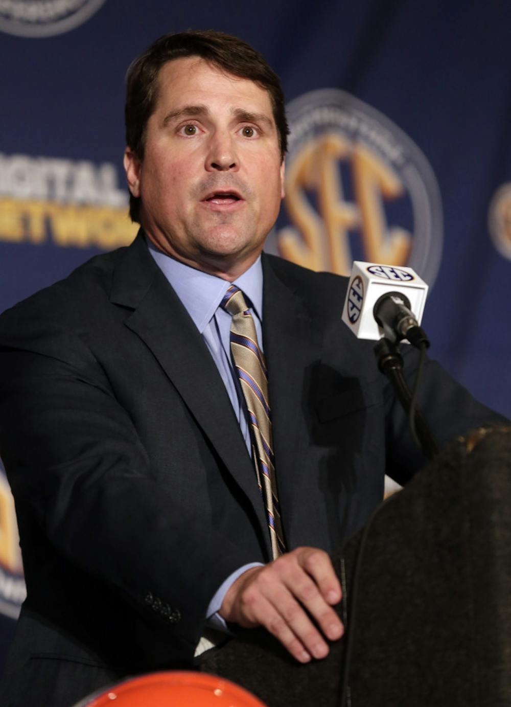 <p>Florida coach Will Muschamp talks with reporters during the Southeastern Conference football Media Days in Hoover, Ala., on July 16, 2013. Muschamp held a football camp over the weekend for potential recruits.</p><p><span> </span></p>