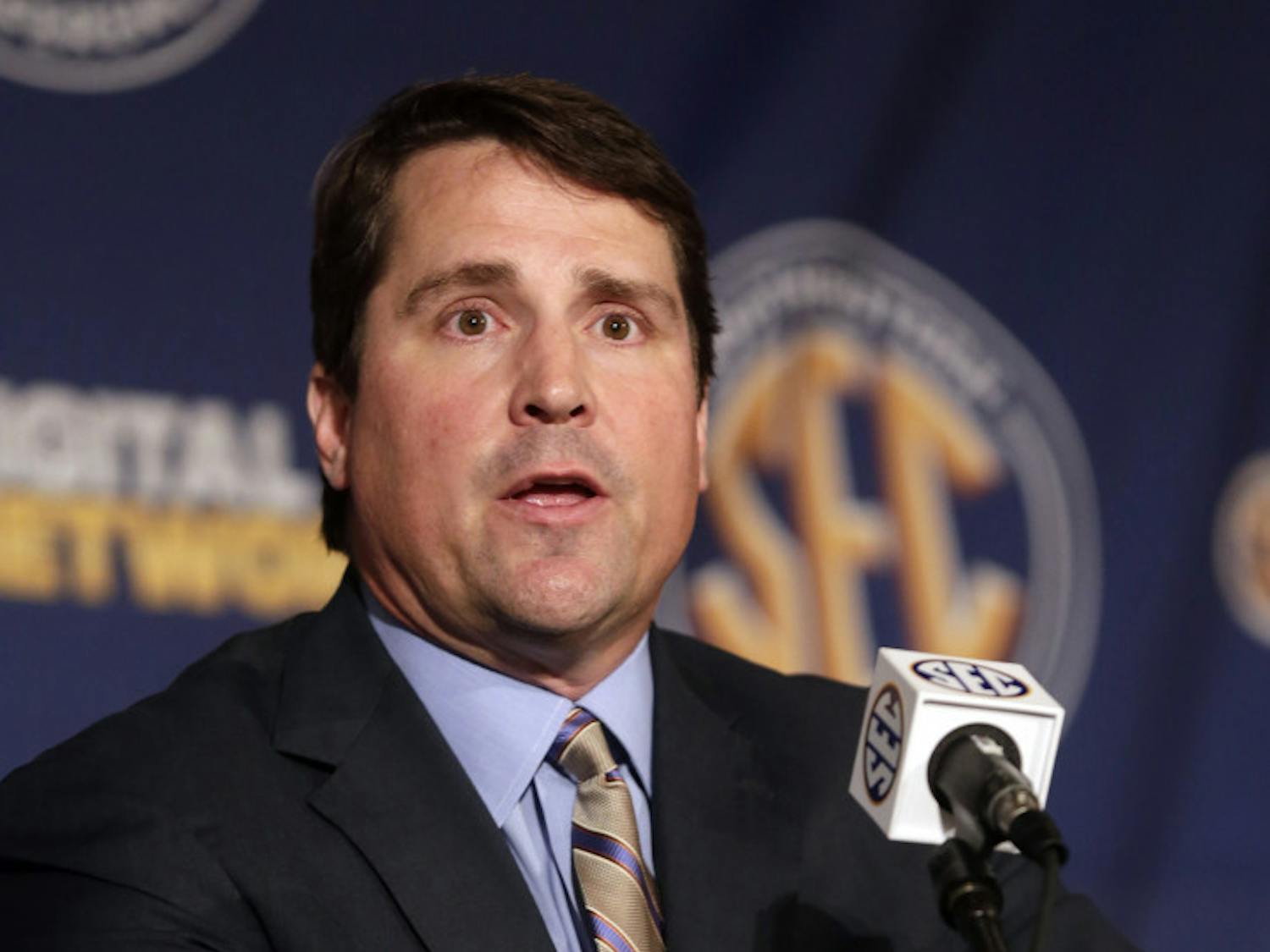 Florida coach Will Muschamp talks with reporters during the Southeastern Conference football Media Days in Hoover, Ala., on July 16, 2013. Muschamp held a football camp over the weekend for potential recruits. 