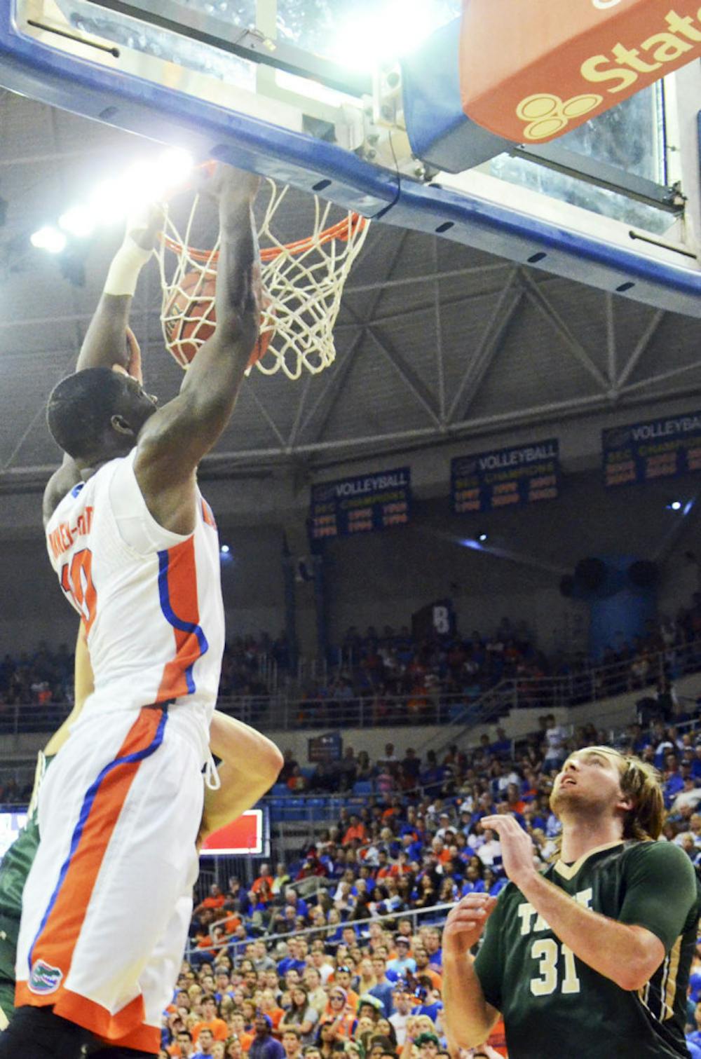 <p>Dorian Finney-Smith dunks during Florida's win against William &amp; Mary on Friday in the O'Connell Center</p>