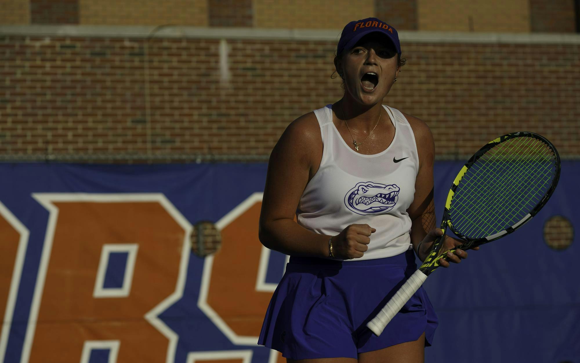Reagan Parker celebrates after scoring against her opponent at Alfred A. Ring Tennis Complex on Friday, March 28, 2025. Jimena Gomez Alonso of University of Arkansas defeated Parker 6-3 and 6-0.