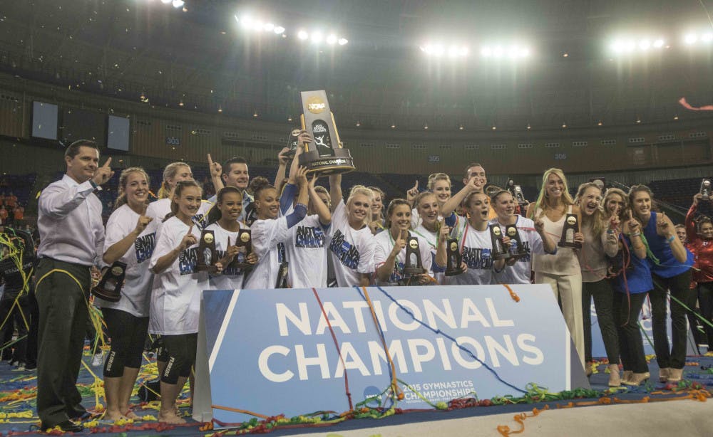 The Florida gymnastics team celebrates wining the NCAA National Championship on Saturday, April 18, 2015 in Fort Worth, Texas.