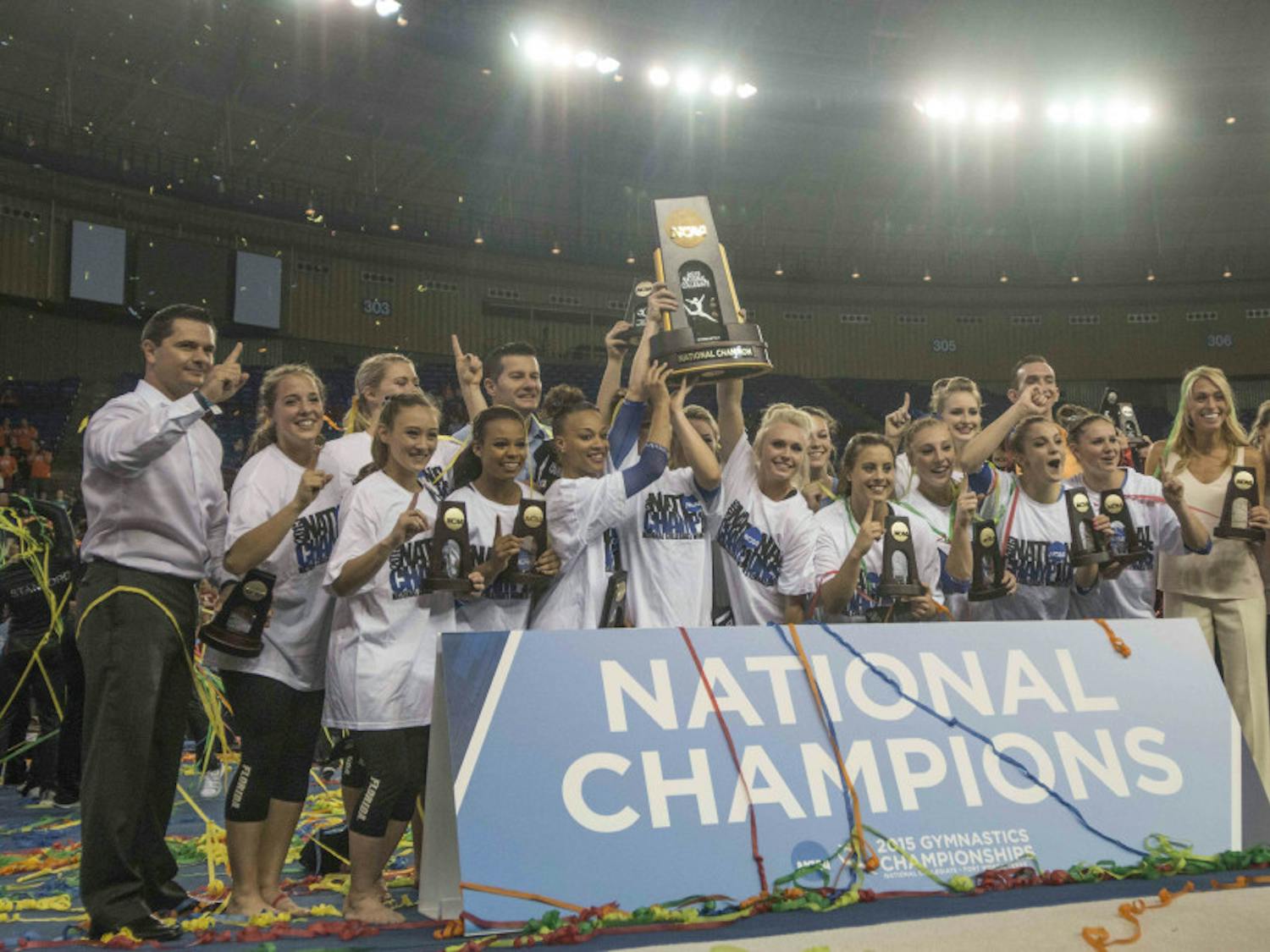 The Florida gymnastics team celebrates wining the NCAA National Championship on Saturday, April 18, 2015 in Fort Worth, Texas.