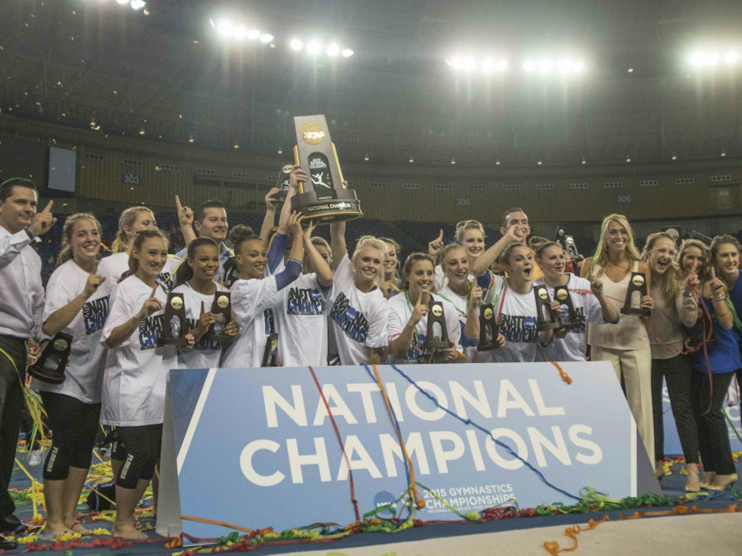 The Florida gymnastics team celebrates wining the NCAA National Championship on Saturday, April 18, 2015 in Fort Worth, Texas.