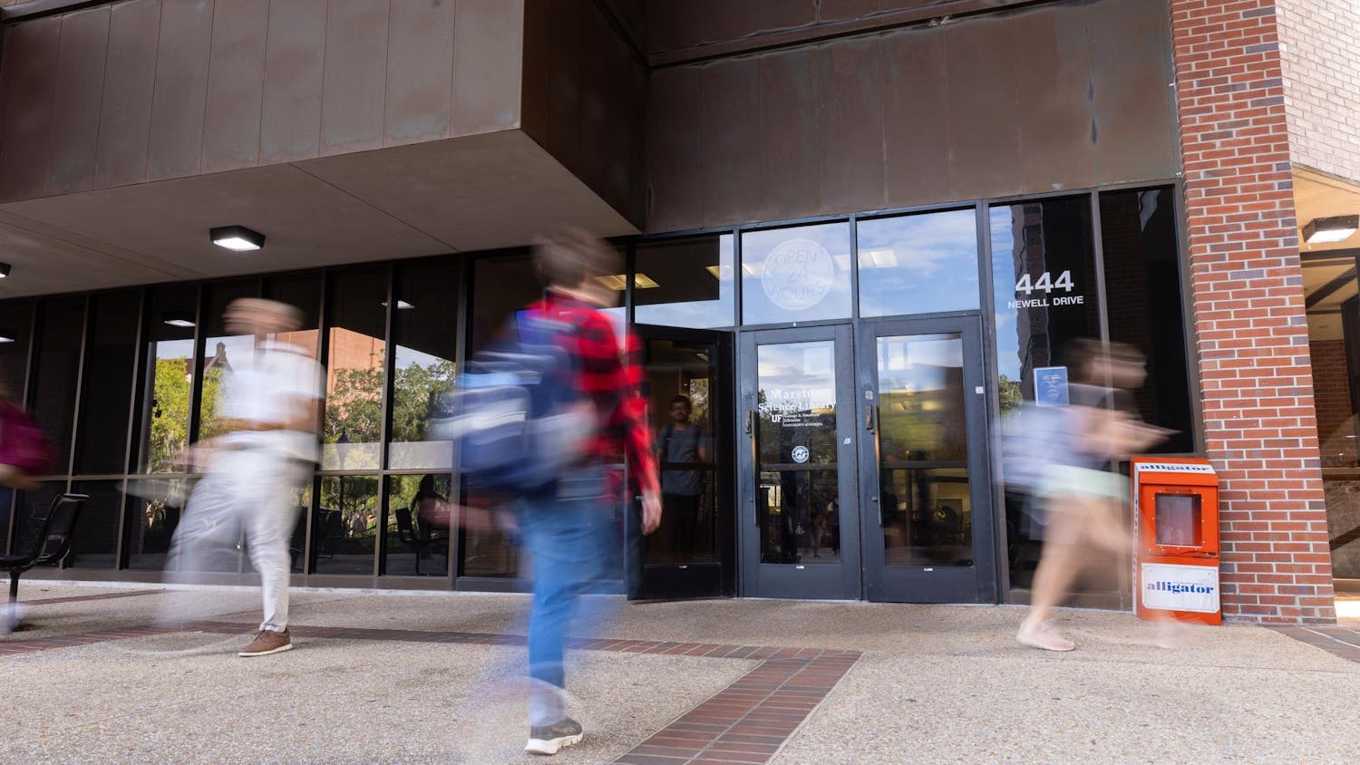 Students are seen entering and exiting Marston Science Library on Wednesday, Oct. 8, 2025.