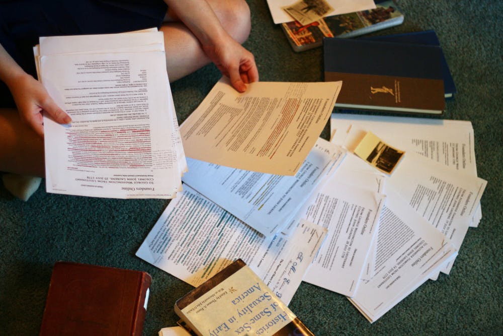 Caitlin Kantner looks through letters from John Laurens and other collected information, which she has gathered for her honors thesis.