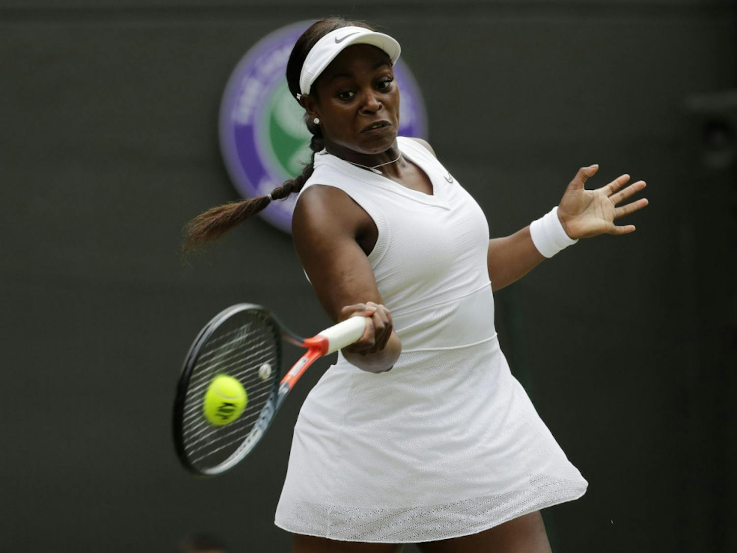 FILE - In this July 6, 2019, file photo, Sloane Stephens returns to Britain's Johanna Konta in a women's singles match at the Wimbledon Tennis Championships in London. Any World TeamTennis player or coach who tests positive for COVID-19 when arriving for the three-week 2020 season will be dropped from the league without pay. The health plan released Tuesday, June 16, 2020, by the WTT for its matches starting July 12 at The Greenbrier in West Virginia also calls for two daily temperature checks for spectators, no ball kids, a chair umpire aided by electronic line-calling instead of line judges, and no high-fives or handshakes between opponents. The rosters announced for the WTT's nine teams include Grand Slam title winners Kim Clijsters, Sloane Stephens, Sofia Kenin and the Bryan brothers. (AP Photo/Ben Curtis, File)