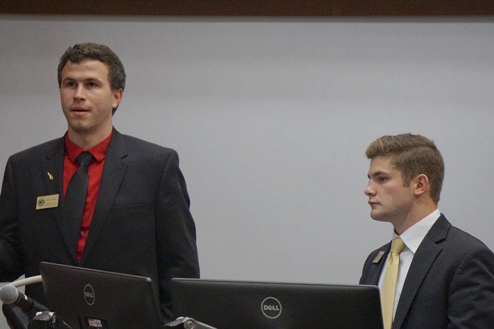 <p>Sean Carey (left), chairman of information and communications committee, and Jason Richards, chairman of the judiciary committee, speak to Student Government about a new senator for Infinity Hall Sept. 16, 2015, at UF Levin College of Law. The debate centered around whether Infinity Hall should have its own senator or be a part of District A.</p>