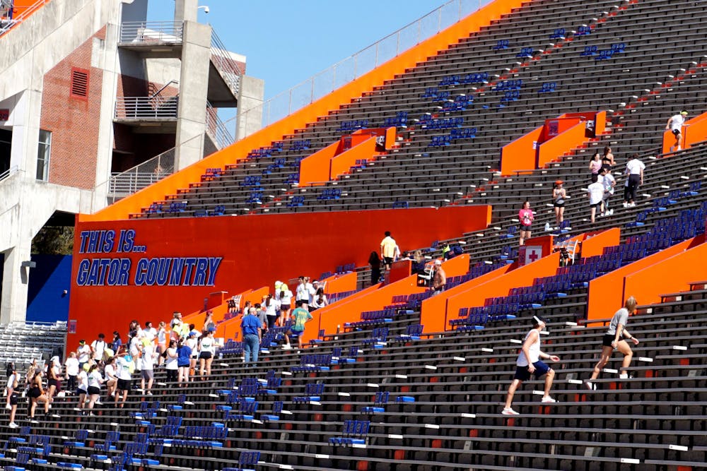 UF students climb up and down the stands of Ben Hill Griffin Stadium on the morning of Saturday, Feb. 26.