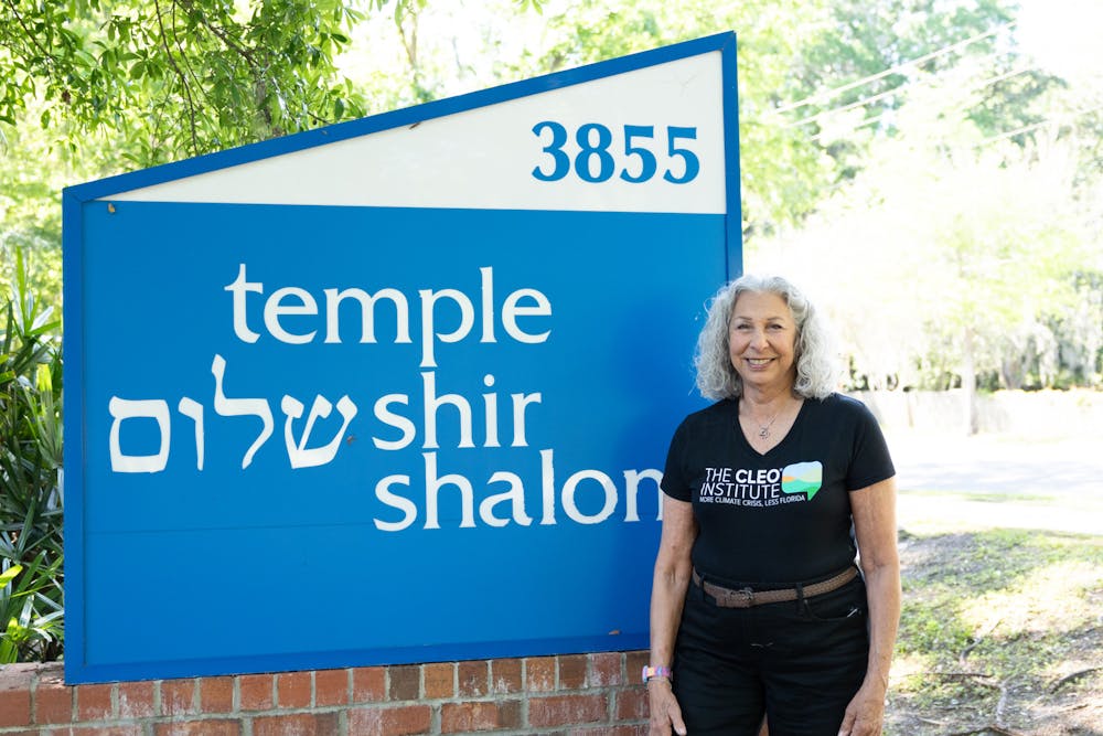 <p>CLEO member Ellen Siegel stands in front of Temple Shir Shalom on Saturday, March 30, 2024.</p>