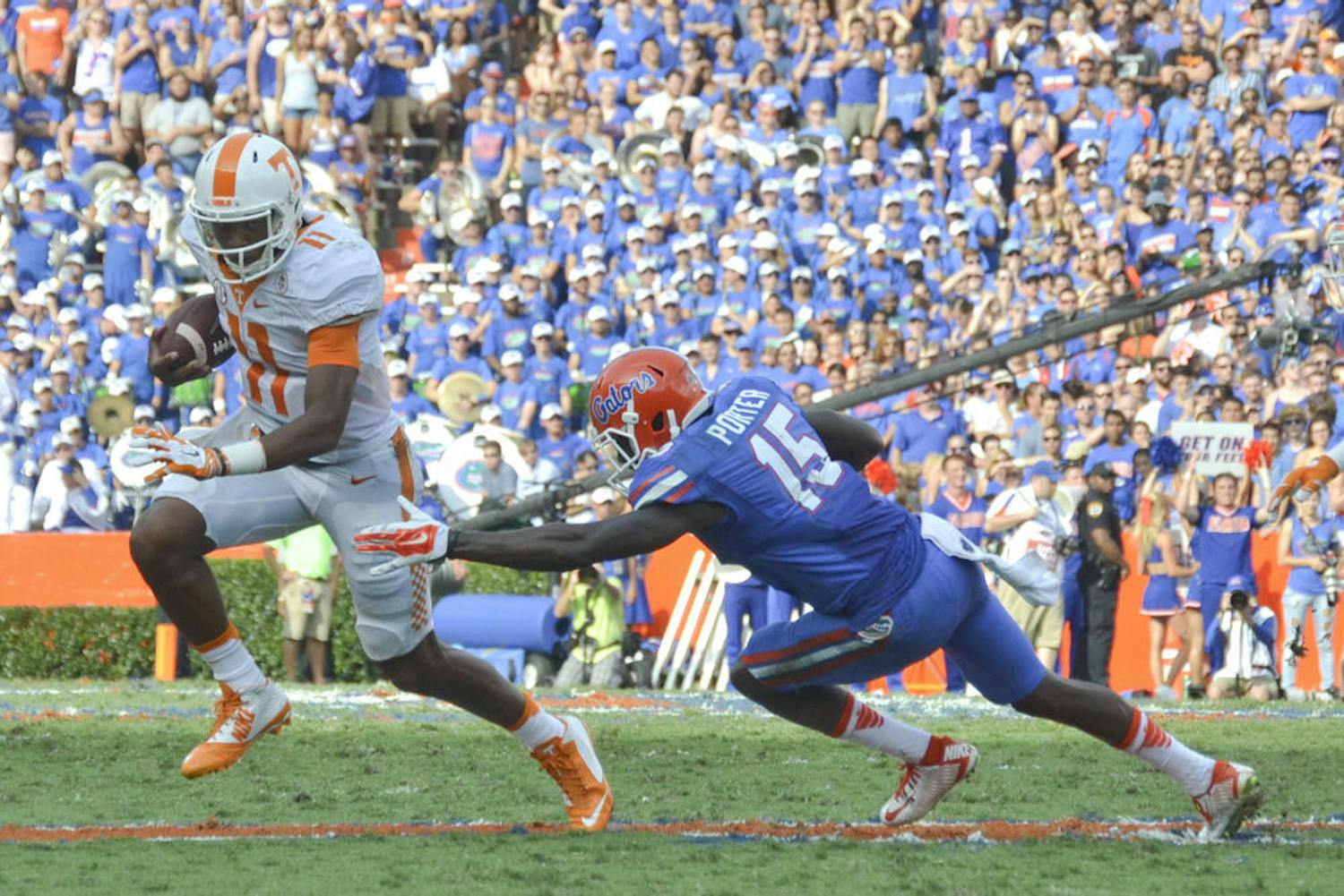 UF defensive back Deiondre Porter misses a tackle on Tennessee quarterback Josh Dobbs during Florida's 28-27 win on Sept. 26, 2015, at Ben Hill Griffin Stadium.