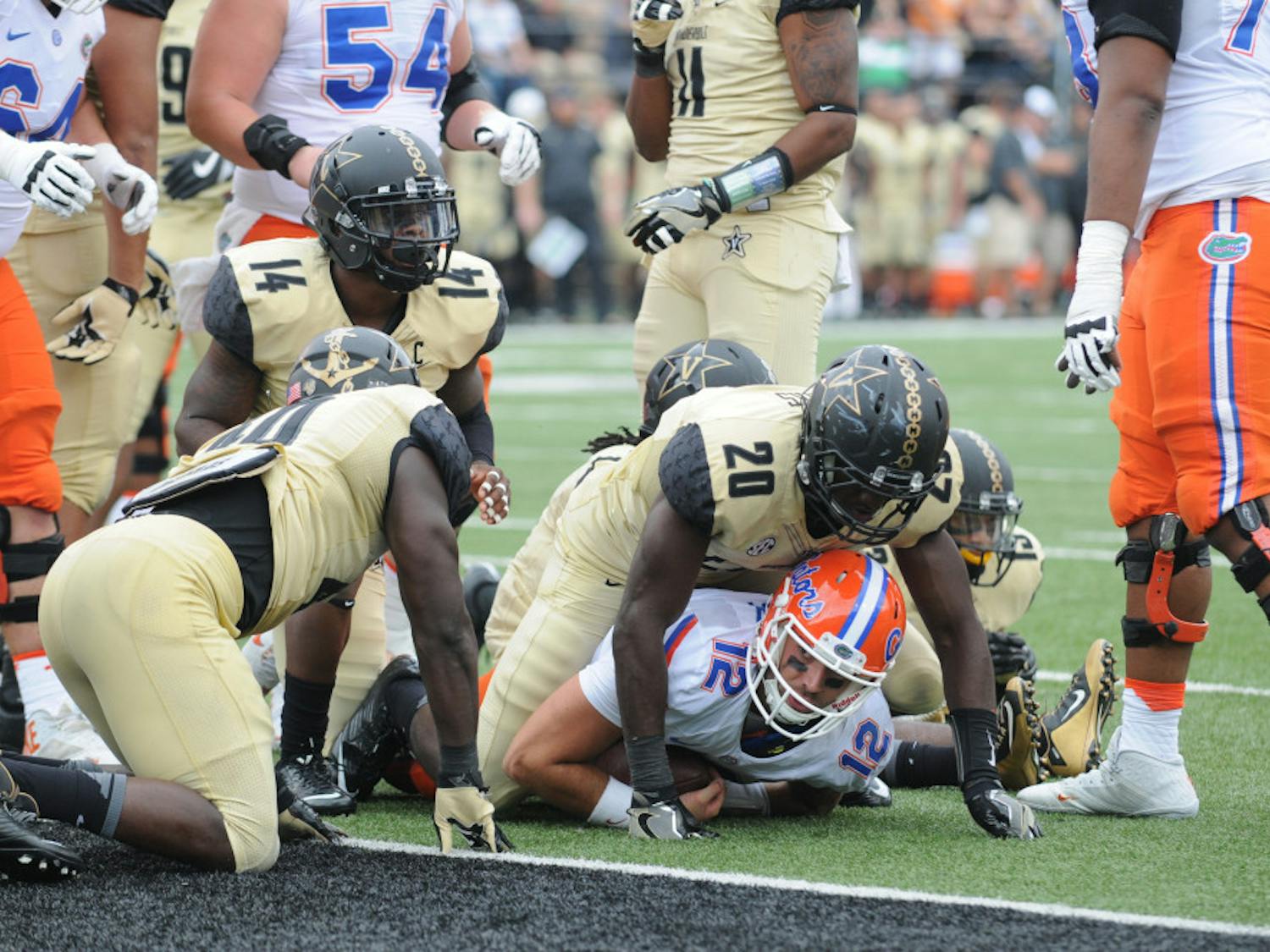 Quarterback Austin Appleby (12) is tackled by a Vanderbilt defender short of the goal line during Florida's 13-6 win over the Commodores on Oct. 1, 2016, at Vanderbilt Stadium.