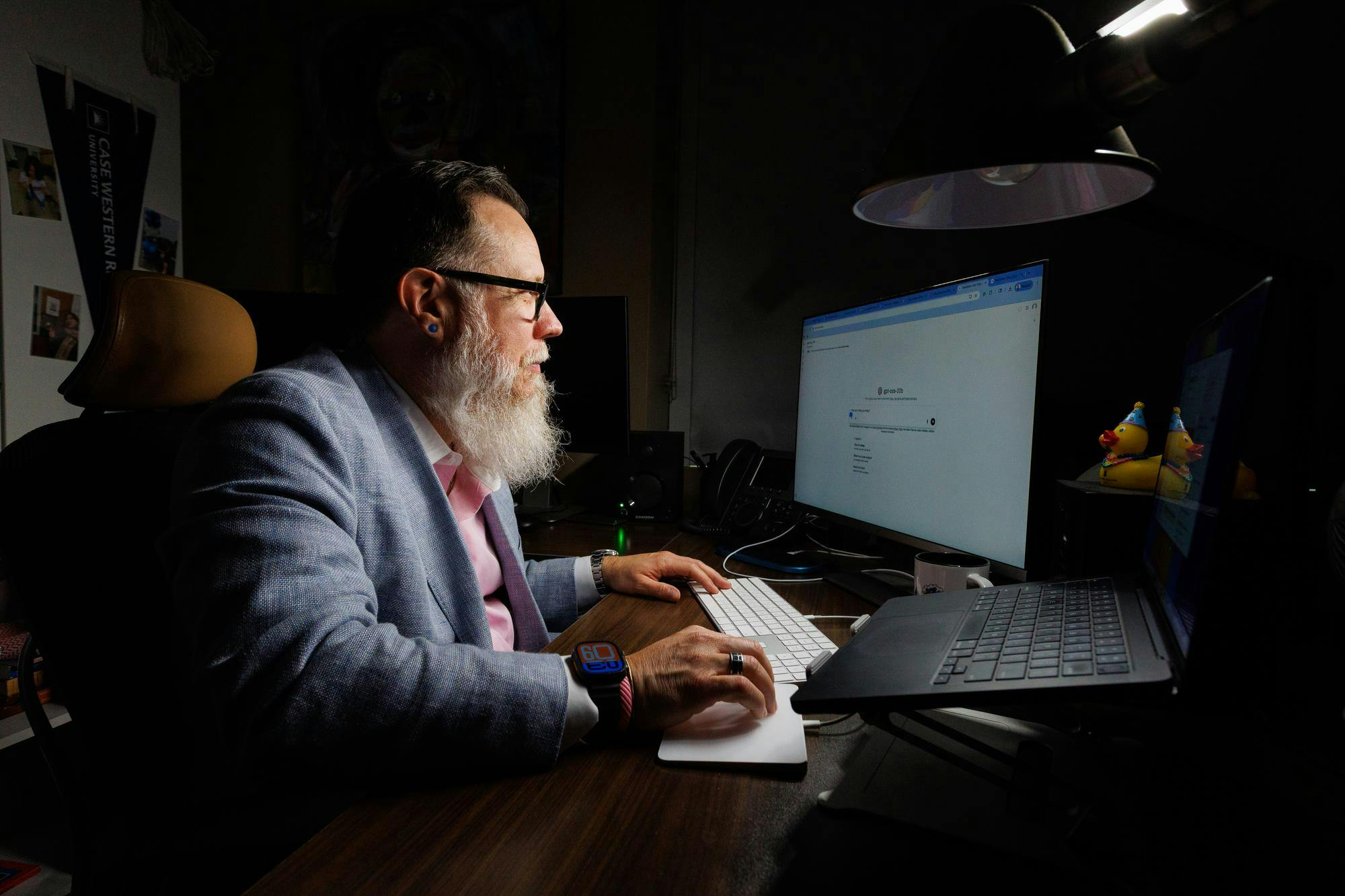 Brian Avery, the Senior Lecturer in the University of Florida Department of Sport Management, looks at his computer in his office, Thursday, April 9, 2026
