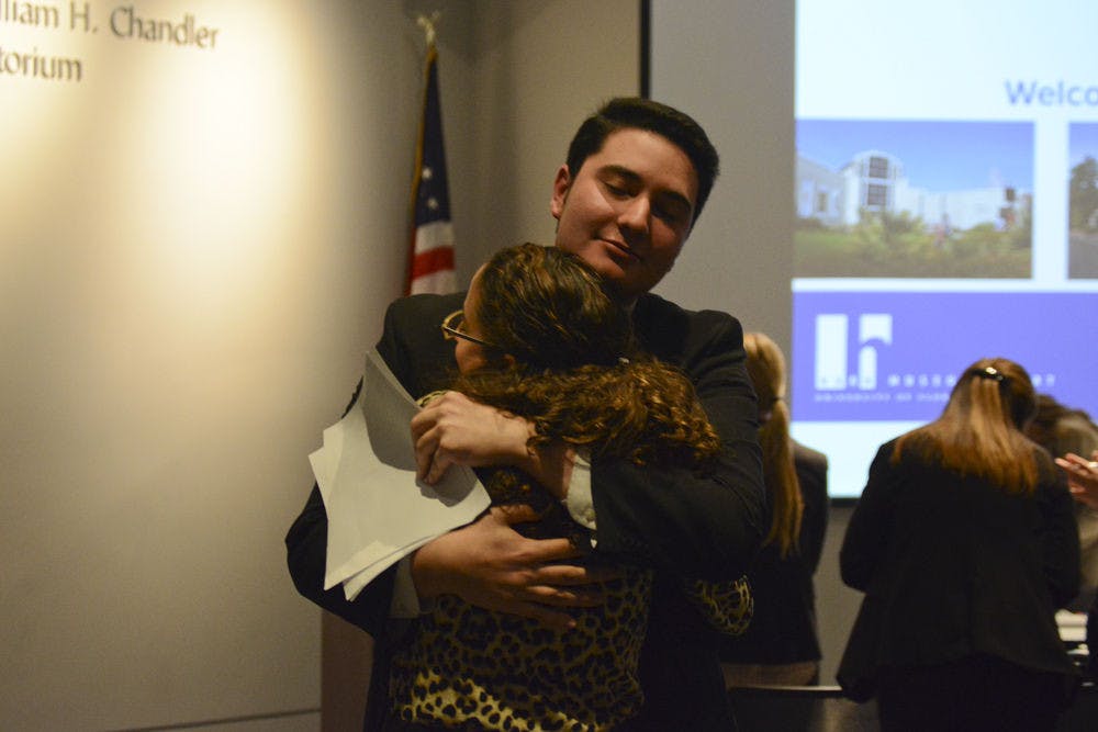 <p>Sen. Michael Christ (Graduate, Access) hugs Student Body President Joselin Padron-Rasines on Tuesday night at Christ's last Senate meeting.</p>