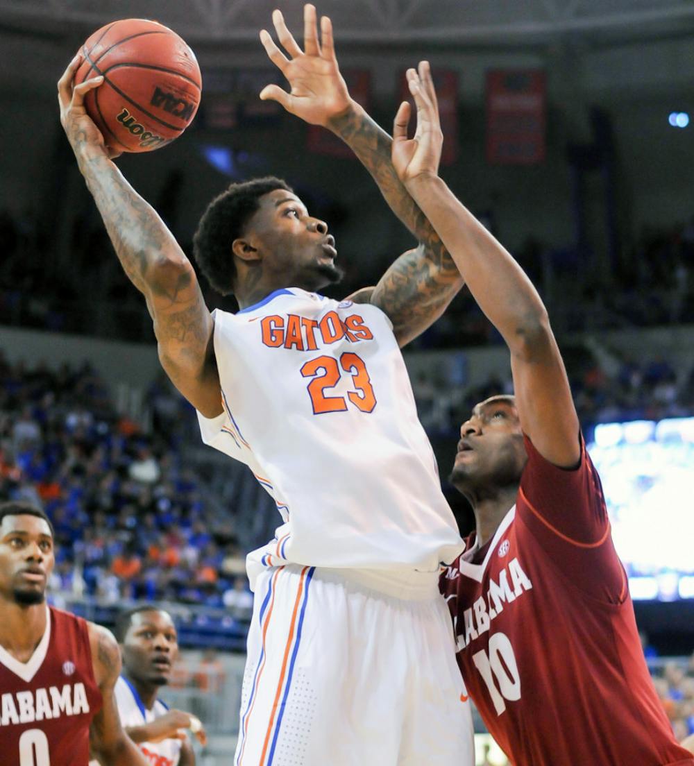 <p>Chris Walker attempts a layup during Florida’s 78-69 win against Alabama on Saturday in the O’Connell Center. Walker scored four points in four minutes against ‘Bama.</p>