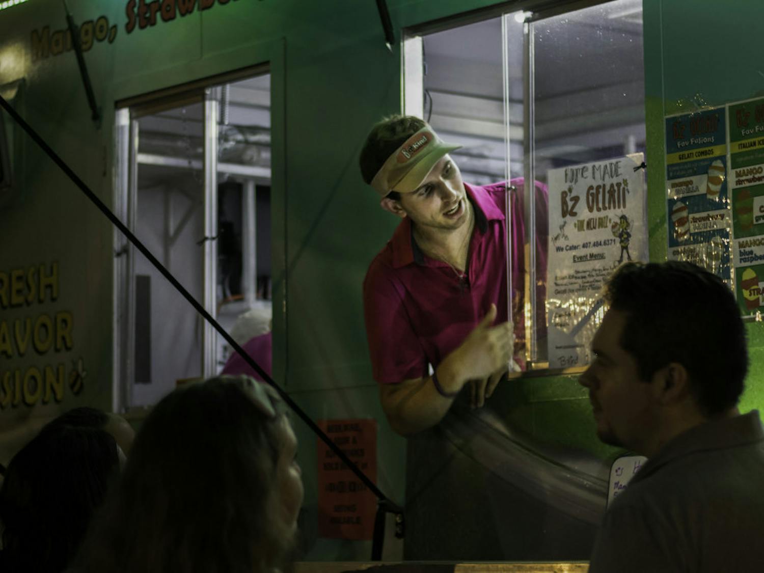 People gathered at High Dive on Saturday during the Original Gainesville Food Truck Rally presented by Glory Days. The event raised money to benefit the UF Mobile Outreach Clinic, which is dedicated to providing medical aid to underprivileged communities. The rally featured a variety of food trucks as well as live music inside the bar. During the event, customers could vote for their favorite food truck by donating to jars held by volunteers beside each vendor. At the end of the night, the food truck with the most won a $100 Publix gift card — this rally’s prize was taken home by Monsta Lobsta, a truck specializing in lobster rolls.
