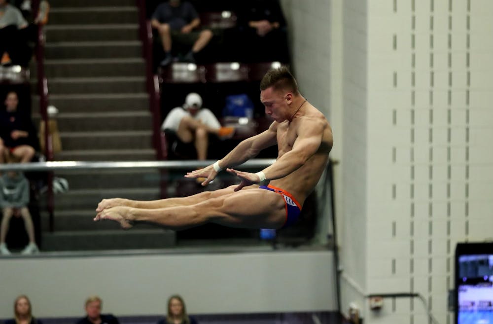 <p>Senior Anton Sviskrkyi dives during the SEC Championship on Saturday, Feb. 18, 2023. </p>
