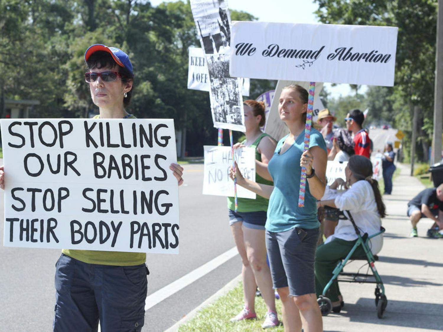About 50 people gathered in front of Planned Parenthood at 914 NW 13th St. on Saturday to protest both for and against abortion.