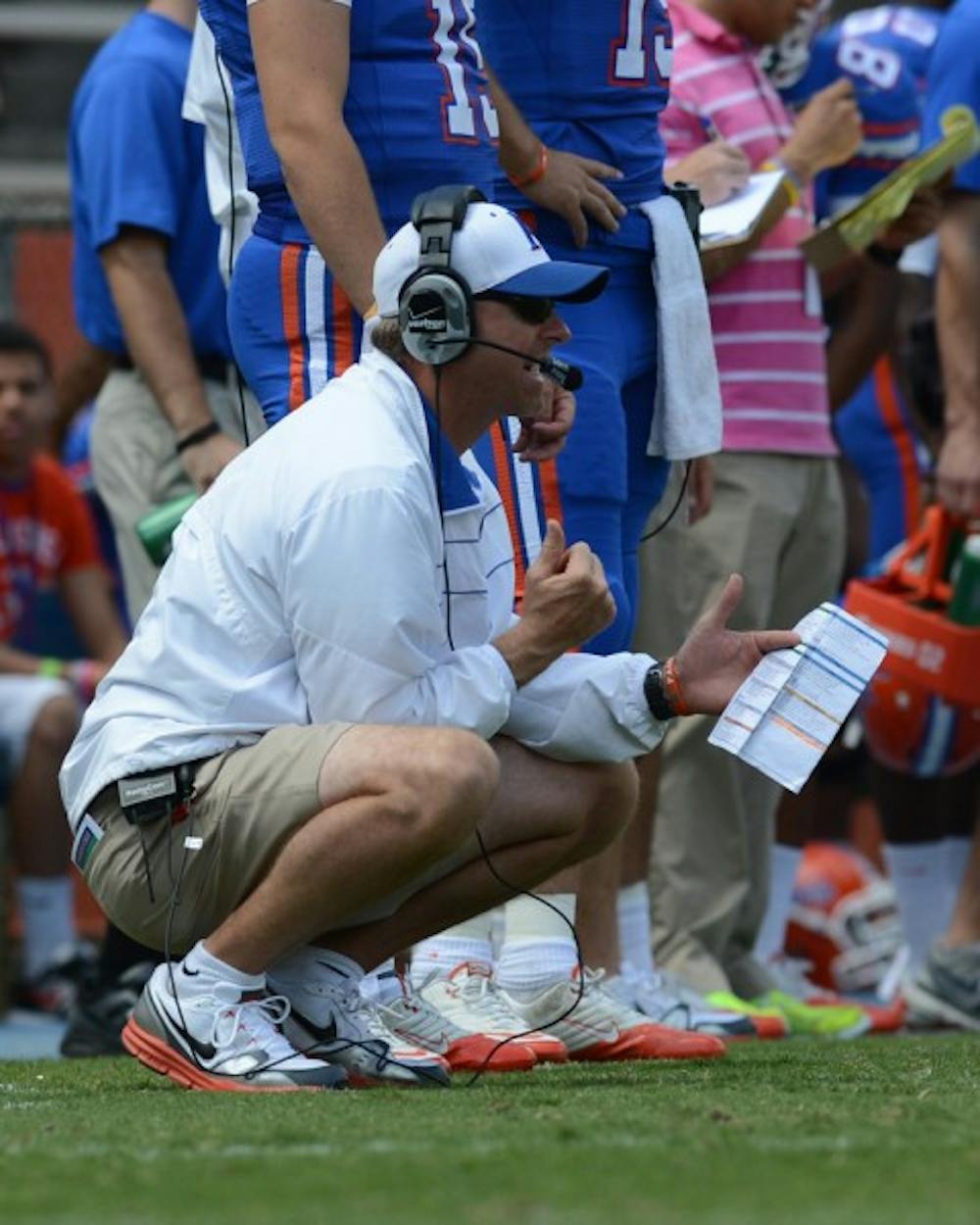 <p>Gators offensive coordinator Brent Pease watches the action during Florida's spring game on last April at Ben Hill Griffin Stadium. Although UF has run the ball 65.8 percent of the time this season, Pease has brought creativity to the offense from his previous job as offensive coordinator at Boise State.</p>