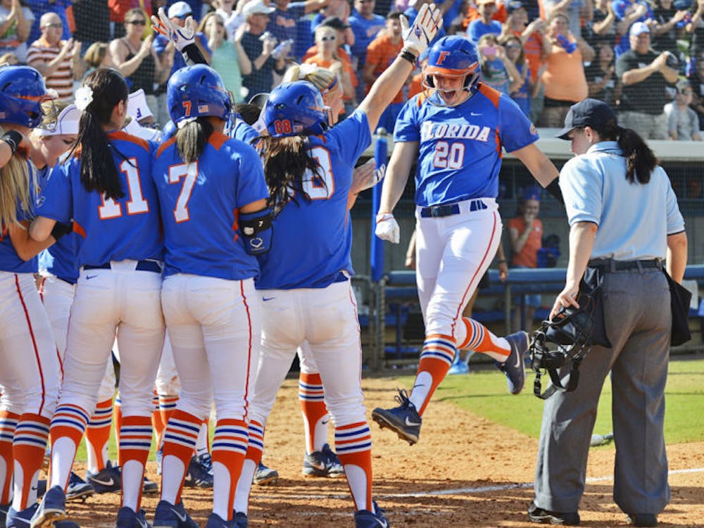 <p>Kelsey Horton (20) celebrates with teammates after scoring a run during Florida’s 4-2 win against Mississippi State on April 6 at Katie Seashole Pressly Stadium.</p>