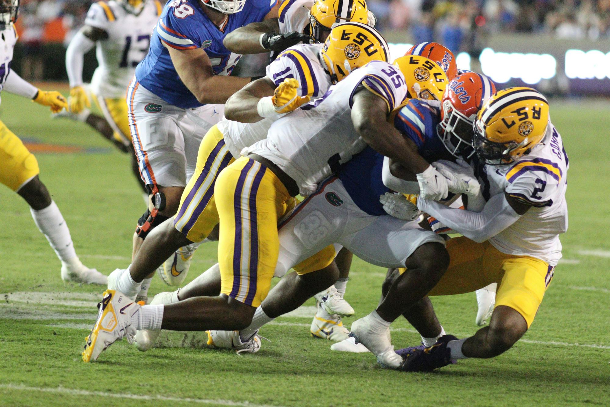 The LSU Tigers swarm tackle Trevor Etienne in the Gators&#x27; 45-35 loss to the LSU Tigers Saturday, Oct. 15, 2022.