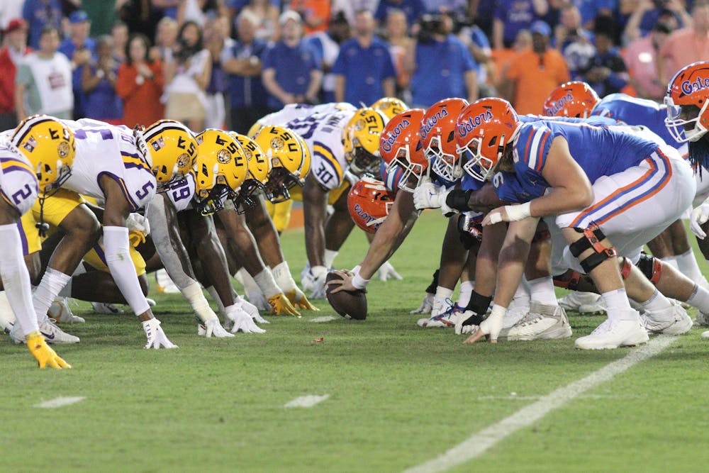 The Florida Gators' offensive line gets set against the LSU Tigers' defensive line in the Gators' 45-35 loss to the Tigers on Saturday, Oct. 15, 2022.