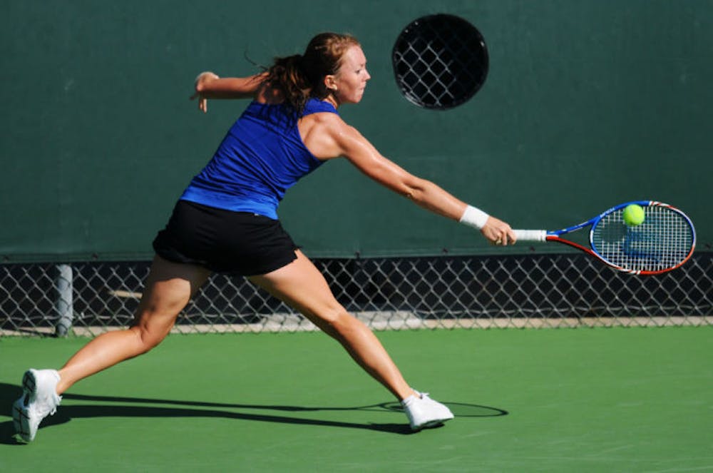 <p>Lauren Embree reaches for a backhand against Georgia at the USTA/ITA Southeast Regional Singles final on Oct. 24, 2011. Embree lost her final dual match as a Gator in Florida’s 4-3 loss to Stanford in the NCAA semifinals on Monday.</p>