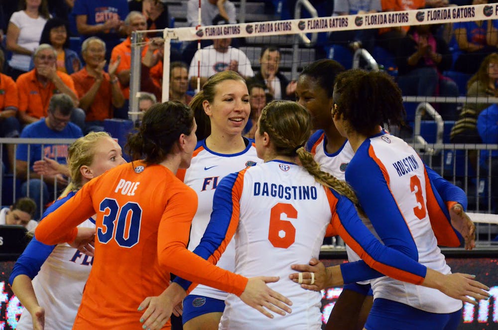 <p>UF players celebrate after a point during Florida's 3-0 win against Missouri on Friday in the O'Connell Center.</p>